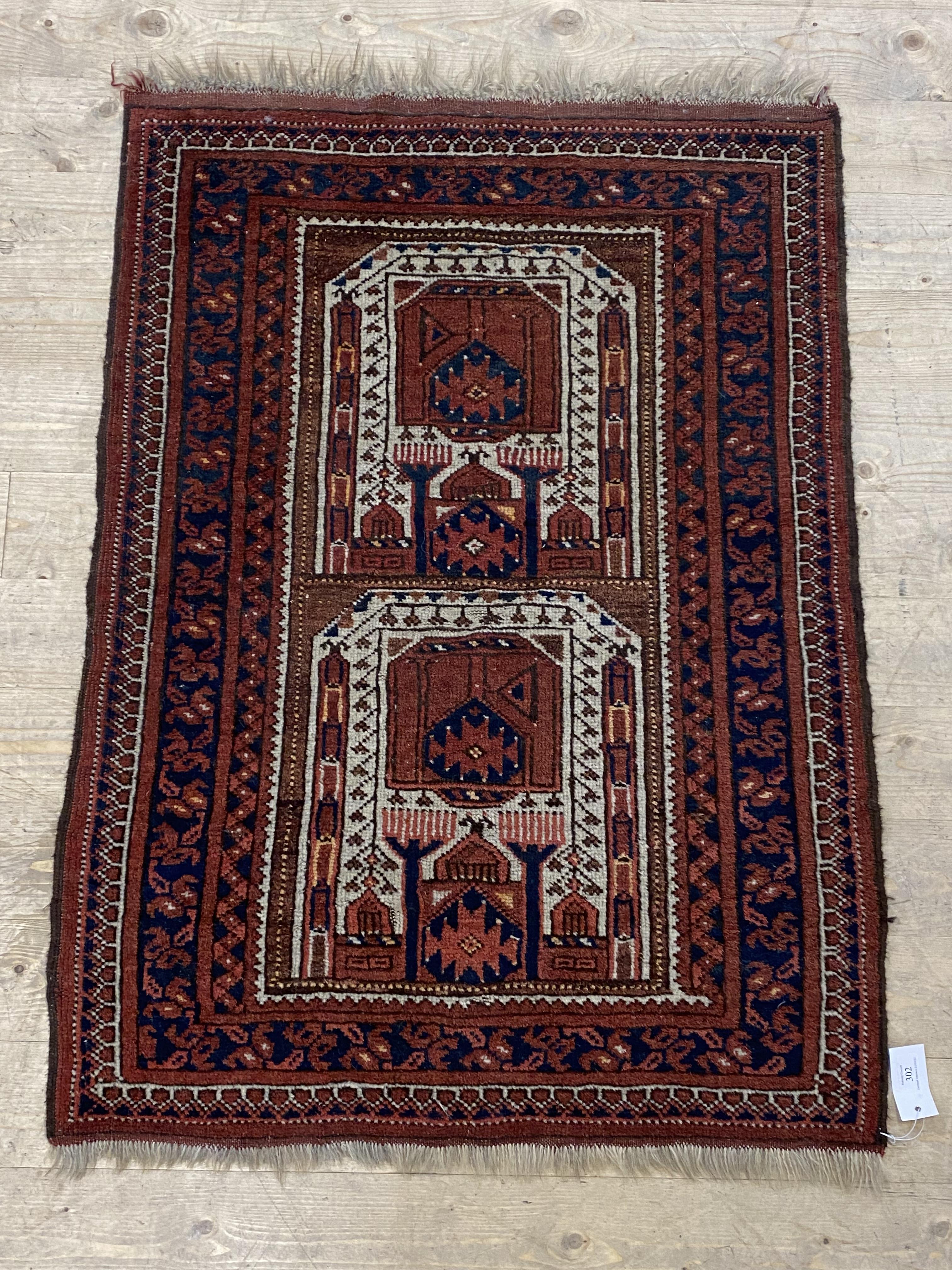 An Afghan prayer rug, the central field with mihrab within a multi line boarder 117cm x 81cm - Image 2 of 2