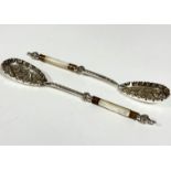 A pair of Epns mother of pearl handled and gilt metal mounted fruit serving spoons with scalloped