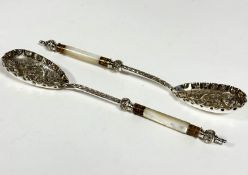 A pair of Epns mother of pearl handled and gilt metal mounted fruit serving spoons with scalloped