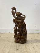 A Chinese carved rootwood statue modelled as a wise man with dragon staff on a naturalistic base,