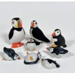 A Hyde Park Loch Gilphead large ceramic puffin figure (H 12cm) and another, and a collection of five