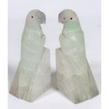 A pair of onyx Parakeet bookends with inset red glass eyes, c.1920 (14cm x 5cm x 5cm), one slight