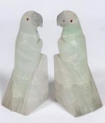 A pair of onyx Parakeet bookends with inset red glass eyes, c.1920 (14cm x 5cm x 5cm), one slight