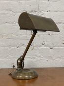 An Edwardian brass articulated desk lamp, stamped Made in England H30cm