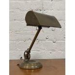 An Edwardian brass articulated desk lamp, stamped Made in England H30cm