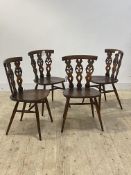 Ercol, a set of four stained elm and beech dining chairs, H79cm