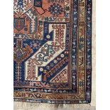 A hand woven Caucasian rug of geometric design with multi line border, 223cm x 124cm