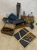 A quantity of vintage tools to include; a cased set of six lathe chisels, a pine box with a quantity