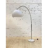 A vintage arc lamp, the moulded opaline shade on a chrome plated adjustable branch, standing on a