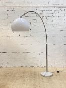 A vintage arc lamp, the moulded opaline shade on a chrome plated adjustable branch, standing on a