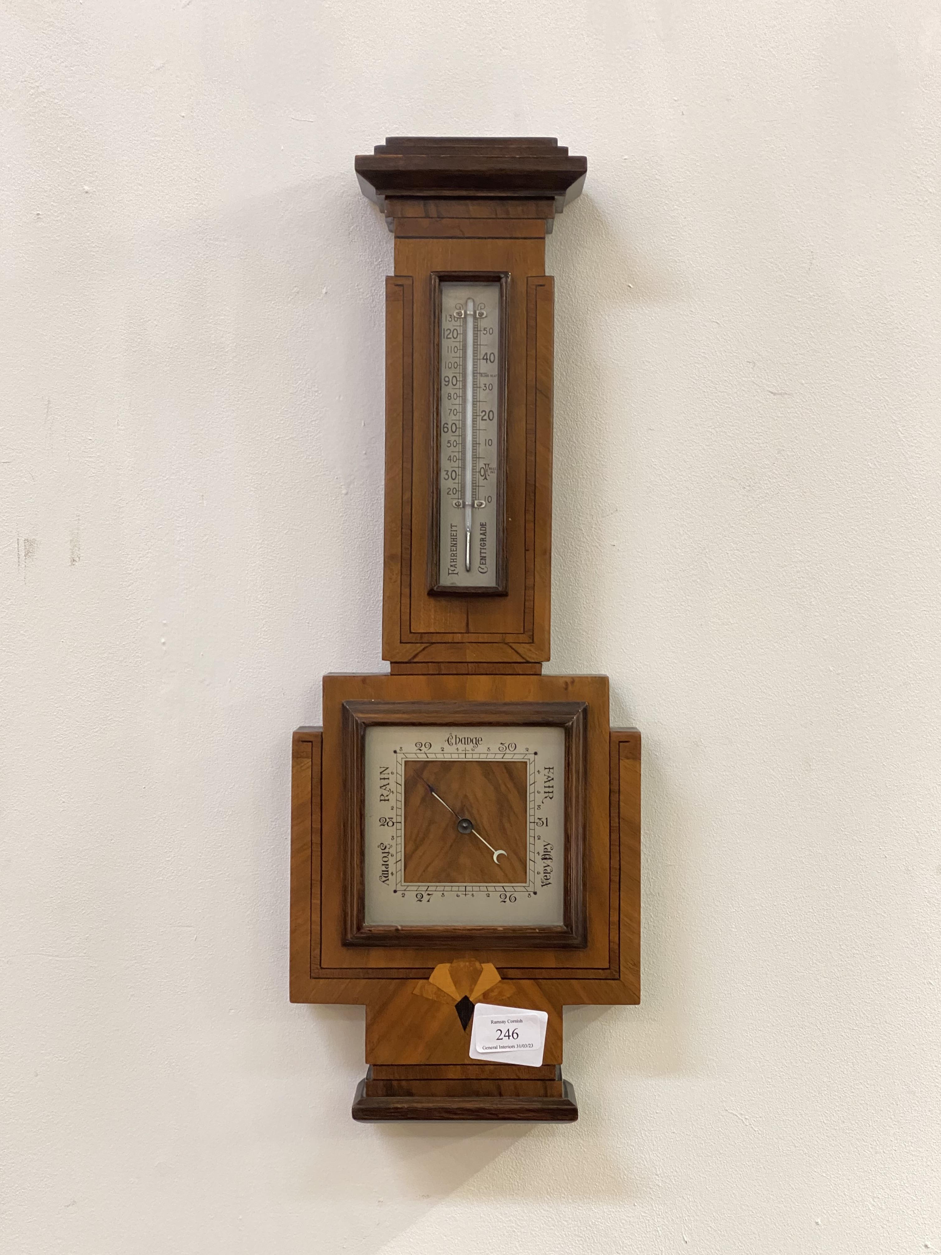 A quality early 20th century aneroid barometer and thermometer in a banjo pattern walnut, rosewood