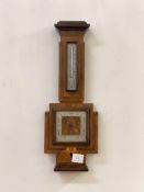 A quality early 20th century aneroid barometer and thermometer in a banjo pattern walnut, rosewood