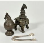 A pair of Epns sugar nips, an Indian bronze birds head mounted censor and an Indian cast brass final