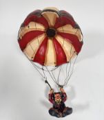 A composition novelty Clown parachuting figure (40cm x d.29cm)