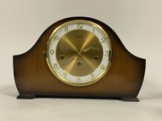 An Art Deco period walnut cased dome top mantle clock, the white and gilt dial with Arabic chapter