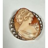 A modern 9ct gold mounted oval shell carved cameo brooch in circular graduated loop border, complete