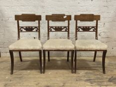 A set of three 19th century mahogany dining chairs, the ebony strung gadrooned crest rail over