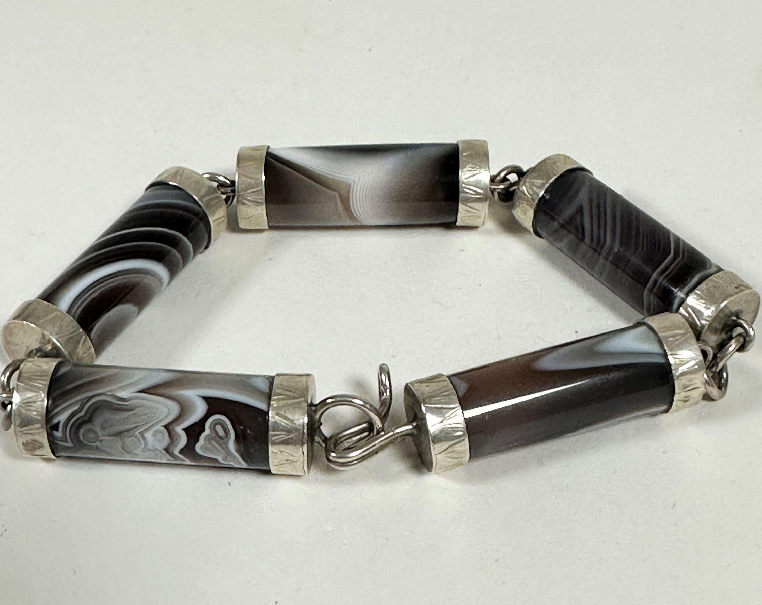 A Scottish agate barrel style bracelet with white metal mounts, (L 22cm) a Scottish style white - Image 2 of 2