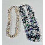 A cultured baroque pearl necklace (L 40cm) of various coloured pearls including white, cream,