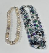 A cultured baroque pearl necklace (L 40cm) of various coloured pearls including white, cream,