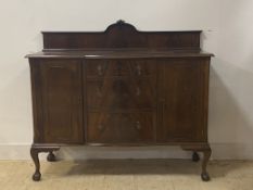 A mahogany ledge back sideboard, bowed centre with three drawers flanked by cupboards, raised on