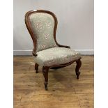 A Victorian mahogany spoon back chair, moving on ceramic castors, H90cm