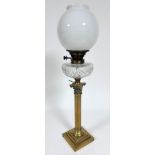 An Edwardian cast brass corinthian column oil lamp converted to electricity by Messengers A&N C.S.