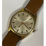 A Gents Omega yellow metal manual wind wristwatch, the silvered dial with applied baton markers,