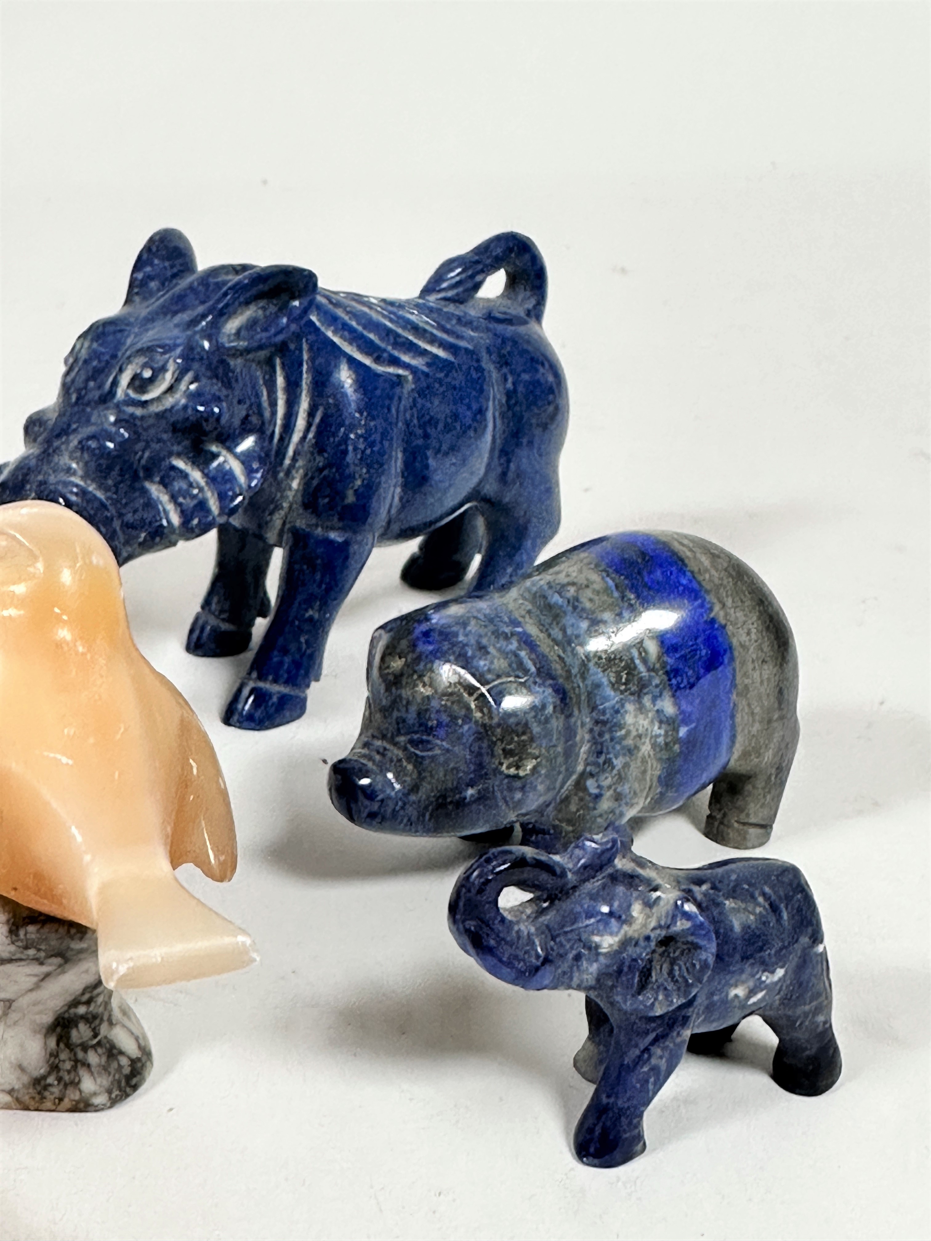 A mixed group of carved animals including a soapstone elephant figure, a block of lapis lazuli, a - Image 4 of 4