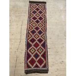 A Kilim runner rug, of all over geometric design, 286cm x 74cm