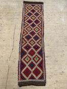 A Kilim runner rug, of all over geometric design, 286cm x 74cm