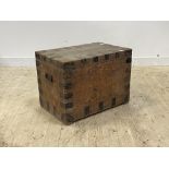 A 19th century pine and metal bound coffer with carry handle to each end and plain interior,