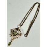 An Edwardian 9ct gold open work brooch pendant set of heart shape, set central oval peridot, set