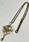 An Edwardian 9ct gold open work brooch pendant set of heart shape, set central oval peridot, set