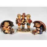 A Hummel pottery figure group School Boys, (20cm x 15cm x 9cm) and a pair of Hummel pottery figures,