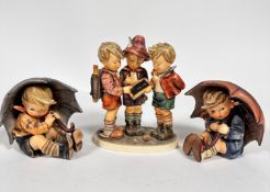 A Hummel pottery figure group School Boys, (20cm x 15cm x 9cm) and a pair of Hummel pottery figures,