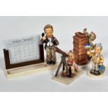 A Hummel pottery standing figure with treen calendar complete with months (h 16cm x 6cm) etc and