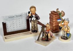 A Hummel pottery standing figure with treen calendar complete with months (h 16cm x 6cm) etc and