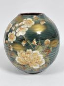 A Japanese ovoid ribbed vase with stylised chrysanthemum and gilt design (30cm x d.26cm), signed