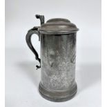 A pewter covered tankard with S scroll handle to side, with engraved inscription New College,