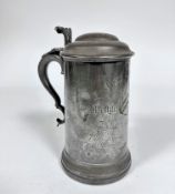 A pewter covered tankard with S scroll handle to side, with engraved inscription New College,