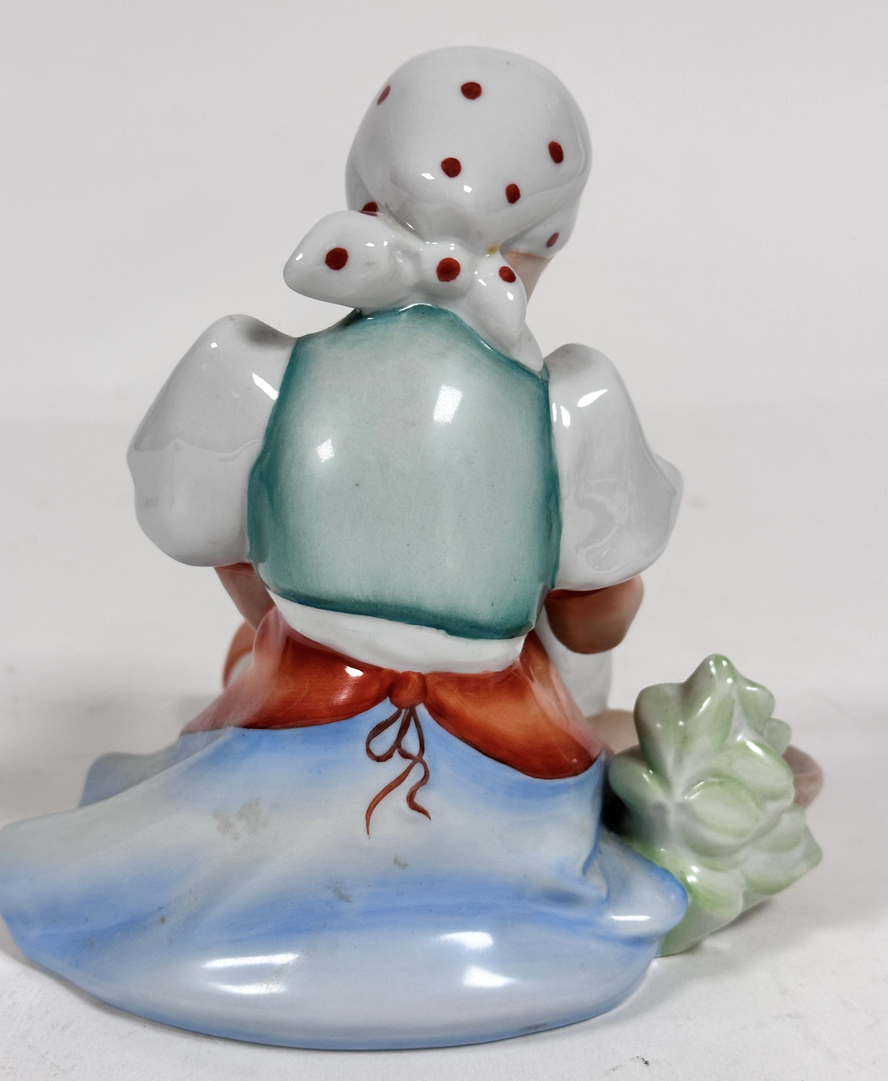 A Herend porcelain figure of a Girl with Goose, decorated with polychrome enamels (17cm x 16cm x - Image 2 of 4