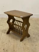 Ercol, a stained elm Canterbury table, on shaped panel end supports, H50cm, W55cm, D36cm