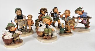 A group of Hummel figures including Barnyard Hero, (h 15cm x 10cm) Homeward Bound, a figure group