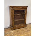 A Victorian burr walnut pier cabinet, the marquetry frieze over glazed door enclosing two shelves,