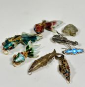 Four various yellow metal enamelled articulated fish pendants and a white metal fish style