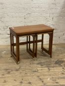 McIntosh, A mid century teak nest of tables, the fold over revolving top with two tables under,
