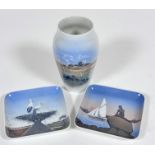 A Danish Royal Copenhagen baluster vase decorated with landscape scene with farm and cloudy sky, (