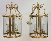 A pair of lacquered brass and glass hall lanterns of cylindrical outline, late 20th century, each