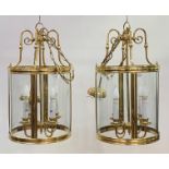 A pair of lacquered brass and glass hall lanterns of cylindrical outline, late 20th century, each